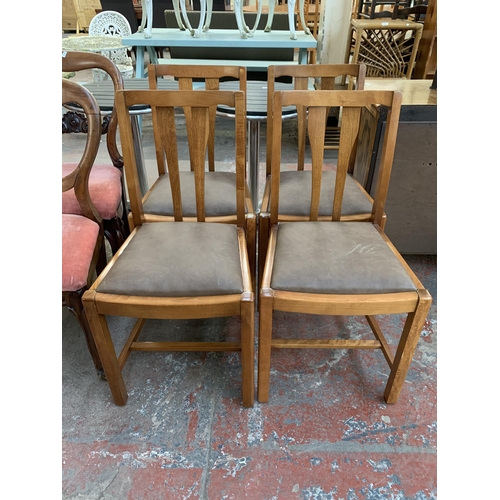 231 - Four mid 20th century beech dining chairs