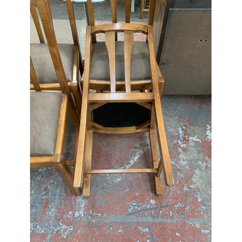 231 - Four mid 20th century beech dining chairs