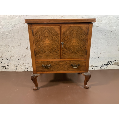 232 - A walnut two door cabinet on cabriole supports with fold over top and brown leather insert - approx.... 