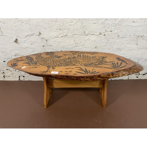 233 - A carved elm live edge coffee table - approx. 35cm high x 36cm wide x 87cm long