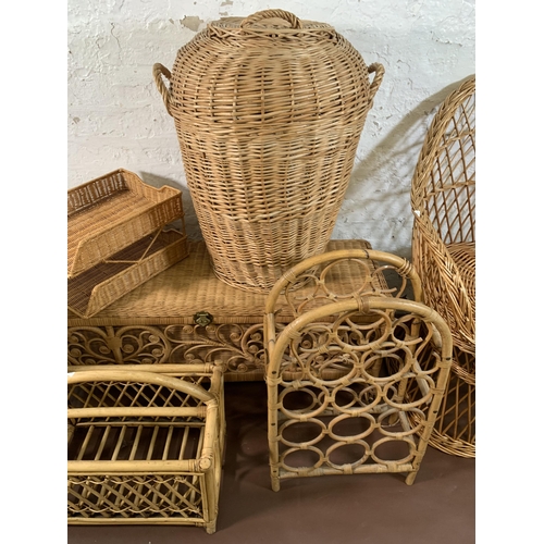 236 - Seven pieces of wicker furniture to include magazine rack, blanket box, jardiniere stand, bottle rac... 