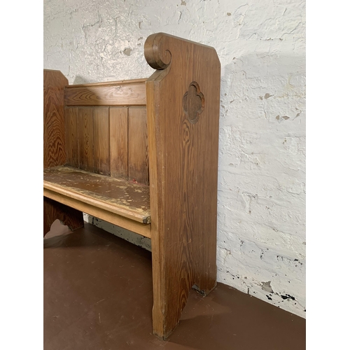 237 - A pitch pine church pew - approx. 95cm high x 102cm wide x 35cm deep