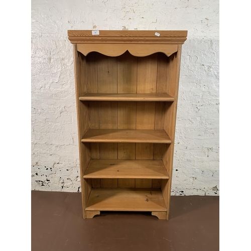 238 - A Victorian style pine four tier bookcase - approx. 122cm high x 64cm wide x 27cm deep