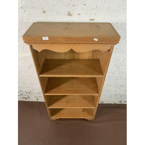 238 - A Victorian style pine four tier bookcase - approx. 122cm high x 64cm wide x 27cm deep