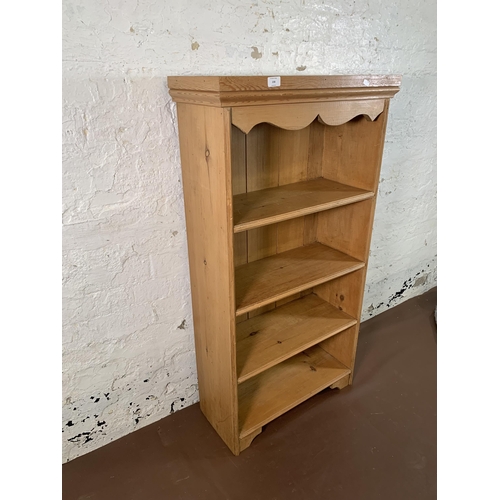 238 - A Victorian style pine four tier bookcase - approx. 122cm high x 64cm wide x 27cm deep