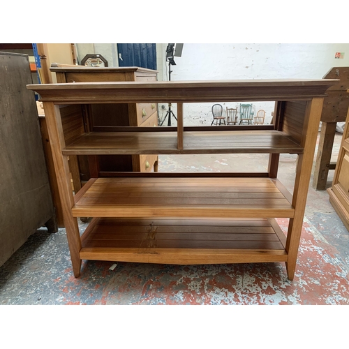 240 - A cherry wood three tier shelving unit - approx. 85cm high x 106cm wide x 43cm deep