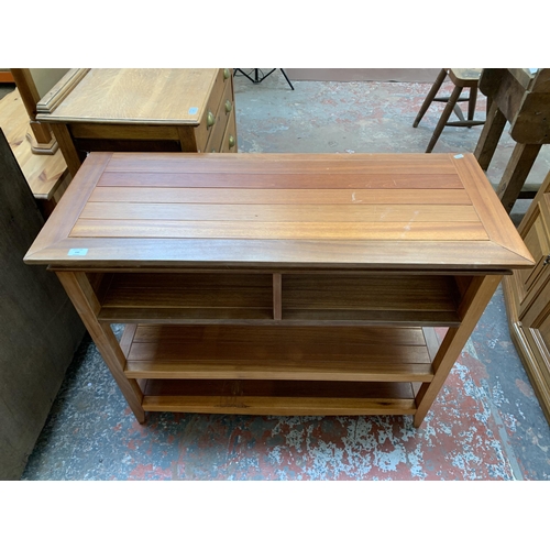 240 - A cherry wood three tier shelving unit - approx. 85cm high x 106cm wide x 43cm deep