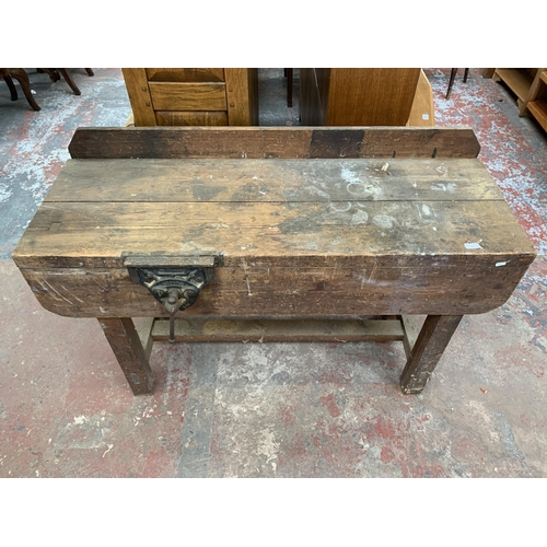 243 - An early 20th century pine workbench with fitted Record No.52 bench vice - approx. 93cm high x 136cm... 