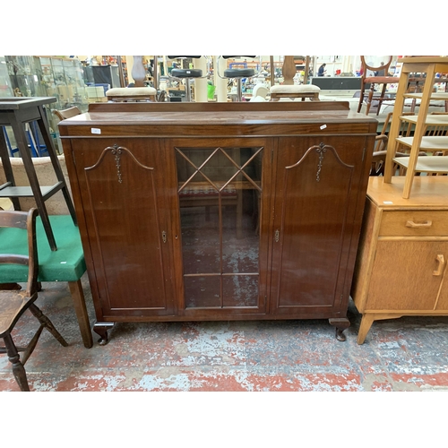 247 - A Harrops Better Furniture of Manchester mahogany display cabinet on cabriole supports - approx. 127... 