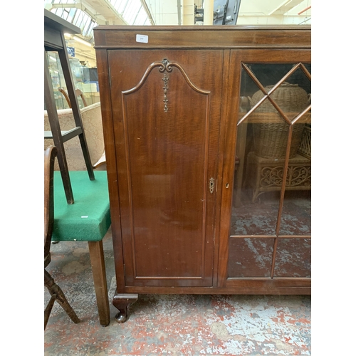 247 - A Harrops Better Furniture of Manchester mahogany display cabinet on cabriole supports - approx. 127... 