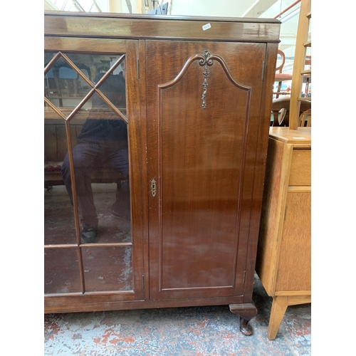 247 - A Harrops Better Furniture of Manchester mahogany display cabinet on cabriole supports - approx. 127... 