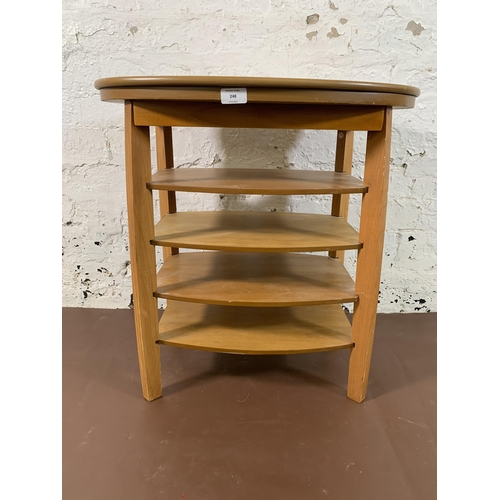 248 - A beech oval swivel top five tier side table - approx. 62cm high x 94cm wide x 38cm deep