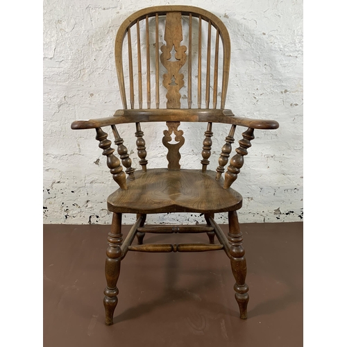 251 - A 19th century elm and beech Windsor chair with carved splat back - approx. 114cm high x 69cm wide x... 