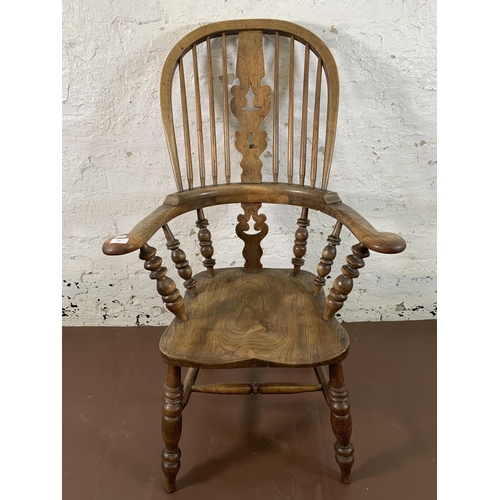 251 - A 19th century elm and beech Windsor chair with carved splat back - approx. 114cm high x 69cm wide x... 