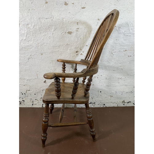 251 - A 19th century elm and beech Windsor chair with carved splat back - approx. 114cm high x 69cm wide x... 