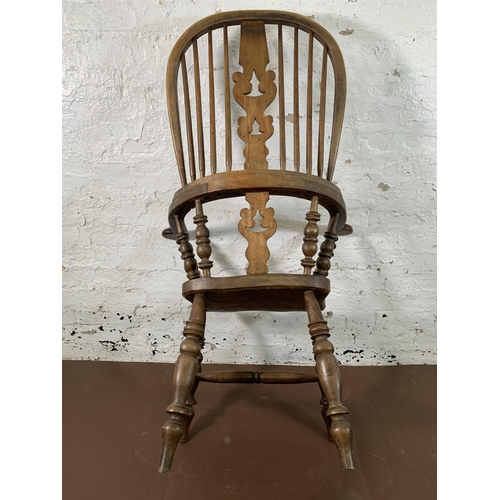 251 - A 19th century elm and beech Windsor chair with carved splat back - approx. 114cm high x 69cm wide x... 