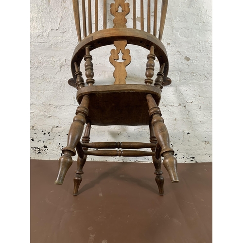 251 - A 19th century elm and beech Windsor chair with carved splat back - approx. 114cm high x 69cm wide x... 