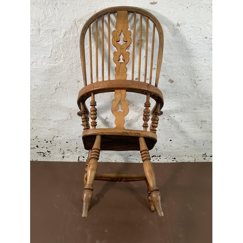 252 - A 19th century elm and beech Windsor chair with carved splat back - approx. 113cm high x 67cm wide x... 