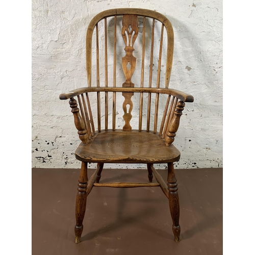 254 - A 19th century elm and beech Windsor chair with carved splat back - approx. 110cm high x 55cm wide x... 