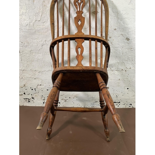 254 - A 19th century elm and beech Windsor chair with carved splat back - approx. 110cm high x 55cm wide x... 