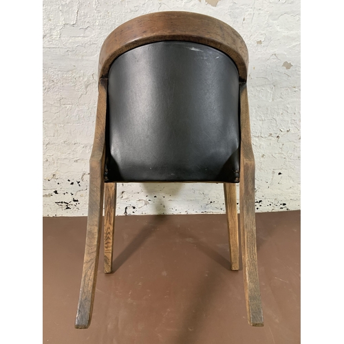 256 - An early/mid 20th century oak and black vinyl desk chair - approx. 78cm high x 55cm wide x 53cm deep