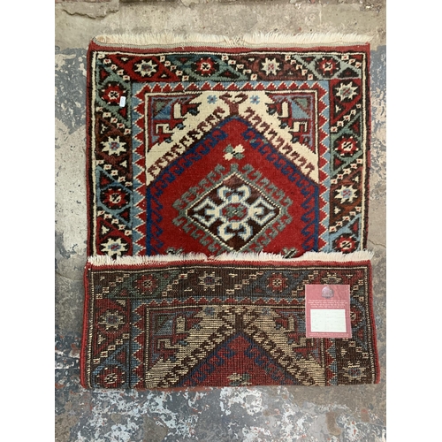 25A - A G.H. Frith Ltd. hand made Oriental rug - approx. 120cm x 72cm