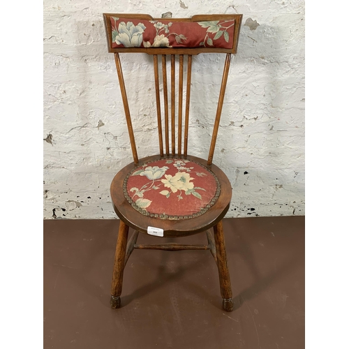 262 - An Edwardian beech and floral fabric upholstered spindle back penny seat occasional chair - approx. ... 