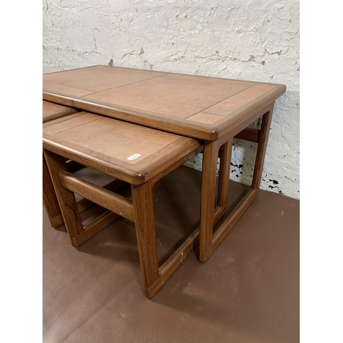 264 - A mid 20th century teak nest of tables with ceramic tile inserts - approx. 39cm high x 84cm wide x 4... 