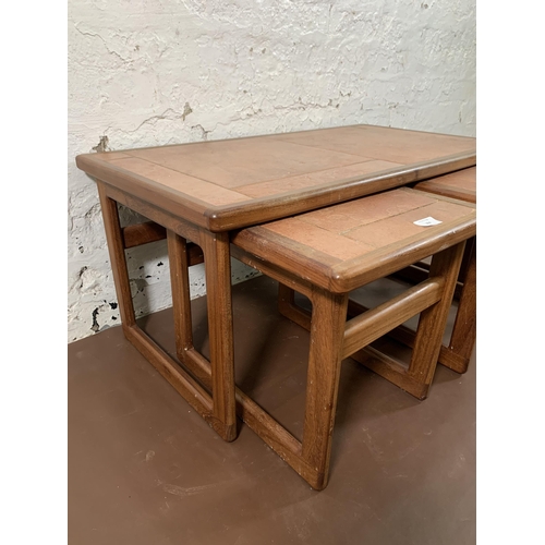 264 - A mid 20th century teak nest of tables with ceramic tile inserts - approx. 39cm high x 84cm wide x 4... 