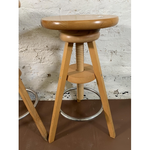 267 - Three modern beech adjustable bar stools - approx. 80cm high x 31cm diameter