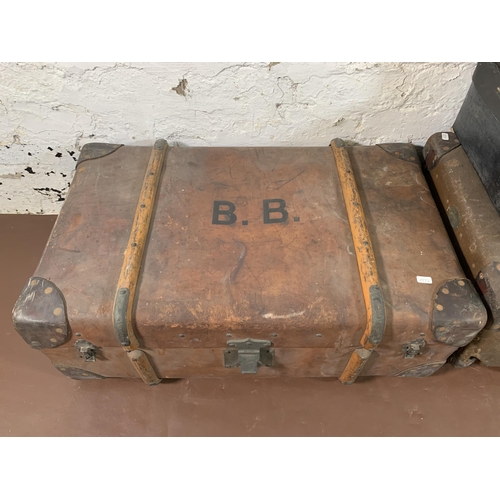 268 - Four early 20th century travel trunks - largest approx. 28cm high x 75cm wide x 47cm deep