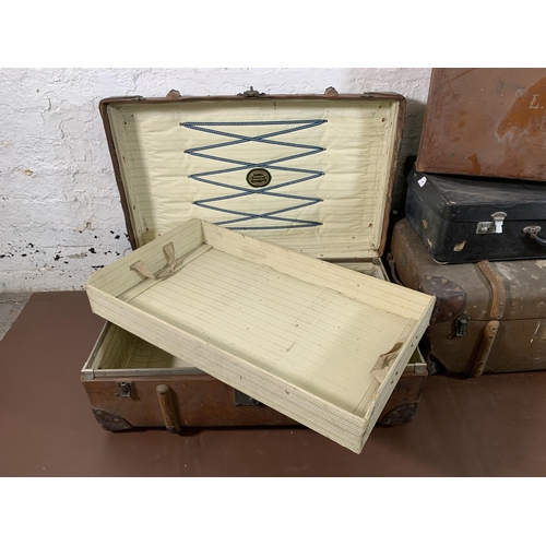 268 - Four early 20th century travel trunks - largest approx. 28cm high x 75cm wide x 47cm deep