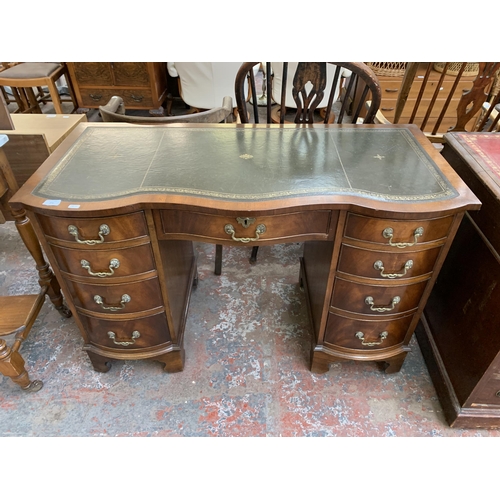 271 - A Bevan Funnell Ltd Reprodux mahogany and green leather serpentine pedestal writing desk - approx. 7... 