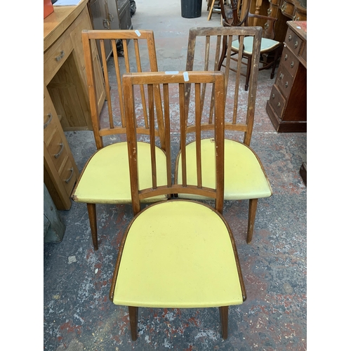 287 - Three mid 20th century Czechoslovakian beech and yellow vinyl upholstered dining chairs