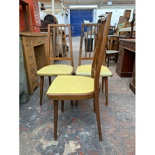 287 - Three mid 20th century Czechoslovakian beech and yellow vinyl upholstered dining chairs