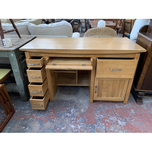 291 - A modern solid oak computer desk - approx. 86cm high x 150cm wide x 69cm deep