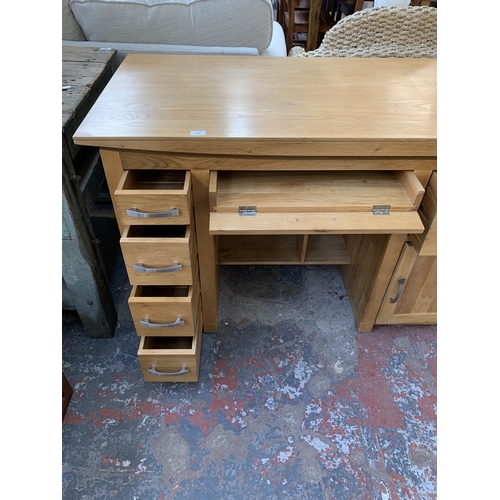 291 - A modern solid oak computer desk - approx. 86cm high x 150cm wide x 69cm deep