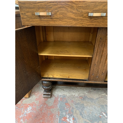 294 - An Art Deco oak sideboard - approx. 108cm high x 124cm wide x 46cm deep