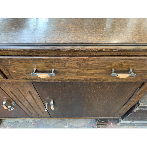 294 - An Art Deco oak sideboard - approx. 108cm high x 124cm wide x 46cm deep