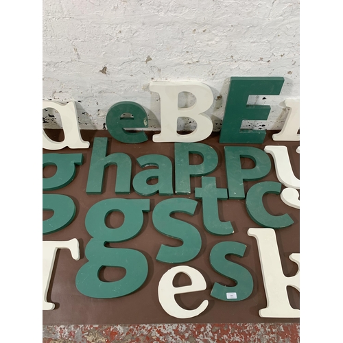 299 - A collection of painted MDF wall hanging letters