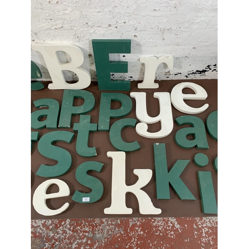 299 - A collection of painted MDF wall hanging letters