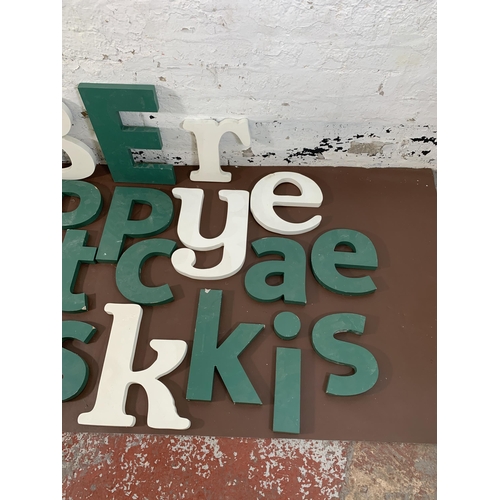 299 - A collection of painted MDF wall hanging letters