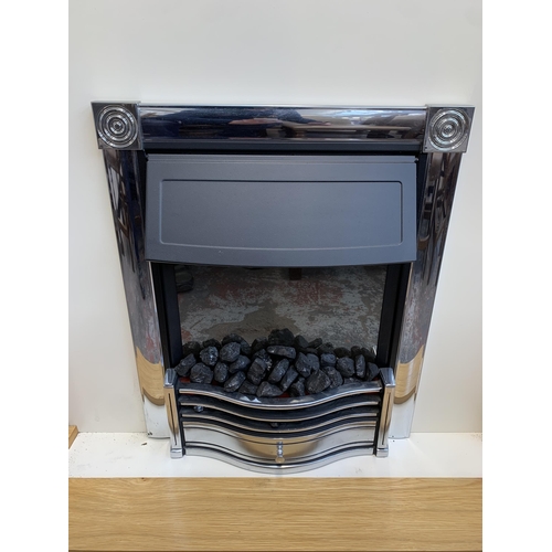 300A - A modern oak fire surround with electric fire - approx. 112cm high x 120cm wide x 38cm deep