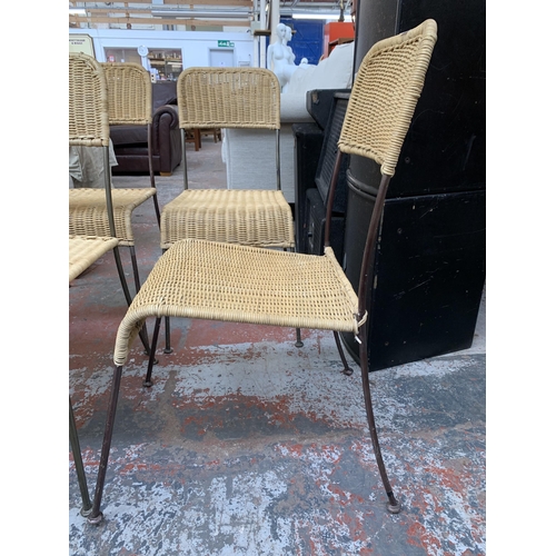 300G - Four wicker and tubular metal patio chairs