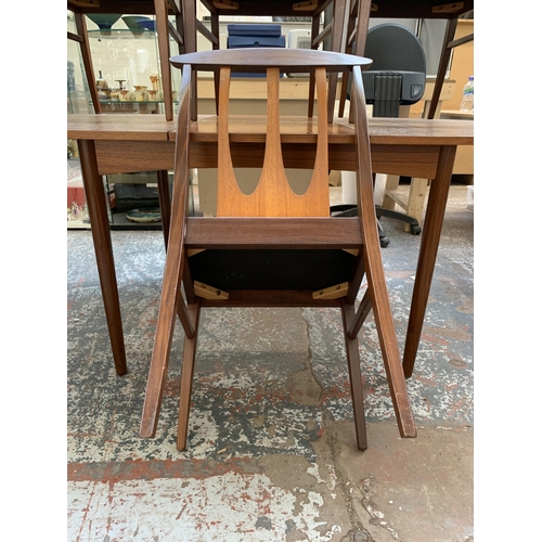 300I - A mid 20th century teak extending dining table and four G Plan Brasilia teak and fabric upholstered ... 