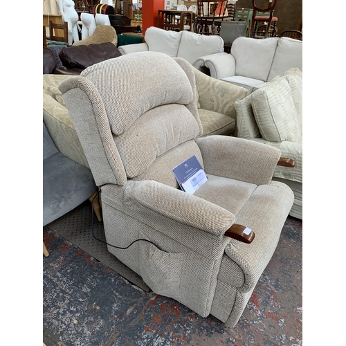 300J - A HSL Aysgarth fabric upholstered electric rise and recline armchair with oak knuckles, remote contr... 