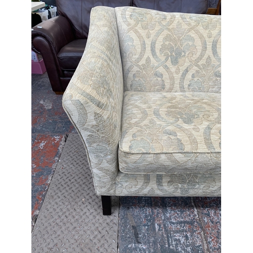 300L - A Parker Knoll floral fabric upholstered three seater sofa - approx. 87cm high x 175cm wide x 97cm d... 