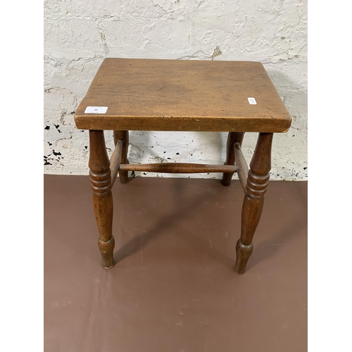 48 - A Victorian elm and beech farmhouse stool - approx. 46cm high x 26cm wide x 38cm long