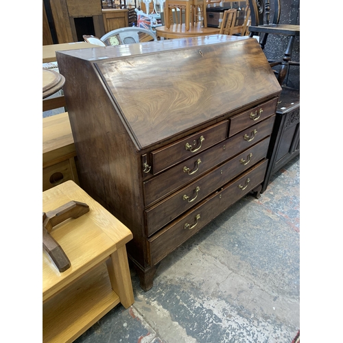 58 - A George III mahogany bureau on bracket supports - approx. 108cm high x 112cm wide x 54cm deep