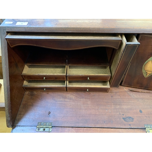 58 - A George III mahogany bureau on bracket supports - approx. 108cm high x 112cm wide x 54cm deep